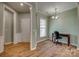 Versatile office space with a large window, hardwood floors, and neutral walls at 4521 Middlebury Ln, Fort Mill, SC 29715
