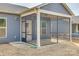 Screened-in porch off the back of a gray home at 4521 Middlebury Ln, Fort Mill, SC 29715