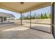 Screened-in porch with views of the backyard and mature trees at 4521 Middlebury Ln, Fort Mill, SC 29715