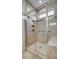 Modern shower with glass door, seating, and a tile surround at 4521 Middlebury Ln, Fort Mill, SC 29715