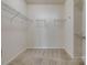 Spacious walk-in closet with carpeted floors and wire shelving on three walls for optimal storage at 4521 Middlebury Ln, Fort Mill, SC 29715
