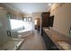 This primary bathroom has a granite countertop, double sinks, a soaking tub, and a standup shower at 4531 Landmark Dr, Rock Hill, SC 29732
