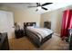 Cozy bedroom featuring plush carpeting, ceiling fan, and neutral tones at 4531 Landmark Dr, Rock Hill, SC 29732