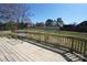 Large wood deck has a wood railing and a table with chairs at 4531 Landmark Dr, Rock Hill, SC 29732