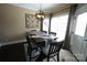 Bright dining room boasts a modern chandelier, neutral walls, and a beautiful view of the outdoors at 4531 Landmark Dr, Rock Hill, SC 29732