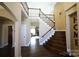 Grand foyer showcasing hardwood floors, staircase with iron railings, and views into the living spaces at 4531 Landmark Dr, Rock Hill, SC 29732