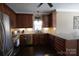 Well-lit kitchen featuring granite countertops, stainless steel appliances, and ample wood cabinetry at 4531 Landmark Dr, Rock Hill, SC 29732