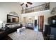 Spacious living room boasting a high ceiling, dark wood floors, a large mirror and access to the foyer at 4531 Landmark Dr, Rock Hill, SC 29732