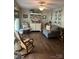 Cozy living room with hardwood floors, a rocking chair, and a decorative china cabinet at 4805 Nesbit Rd, Monroe, NC 28112