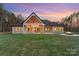 Beautiful backyard with a covered patio, outdoor seating area, and a fire pit, perfect for entertaining at 515 Deanne Dr, Rock Hill, SC 29730