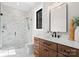 Modern bathroom featuring a glass shower, a wooden vanity and marble floors at 515 Deanne Dr, Rock Hill, SC 29730