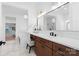 Bathroom featuring dark wood cabinets, a white countertop, and a large mirror above the vanity at 515 Deanne Dr, Rock Hill, SC 29730