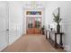 Bright foyer with wooden double doors, light wood floors, and classic white paneled walls at 515 Deanne Dr, Rock Hill, SC 29730