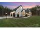Side view of a modern home with a two-car garage and a landscaped yard and black doors at 515 Deanne Dr, Rock Hill, SC 29730