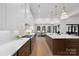 Contemporary kitchen boasts stainless steel appliances, an island, and view into the dining and living space at 515 Deanne Dr, Rock Hill, SC 29730