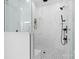 Shower with glass doors featuring white walls with gray marble streaks and matte black shower hardware at 515 Deanne Dr, Rock Hill, SC 29730