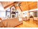 Inviting living room with a vaulted wooden ceiling, fireplace, and comfortable seating at 6142 Gold Creek Estate Dr, Hickory, NC 28601