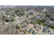 Wide aerial view of a neighborhood showing tree coverage and the setting of the property at 624 Harris Nw St, Concord, NC 28025