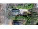 Aerial shot of the property, revealing its setting among trees and a spacious driveway at 624 Harris Nw St, Concord, NC 28025