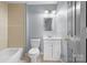 This full bathroom has a tub with tile surround and a modern vanity at 624 Harris Nw St, Concord, NC 28025