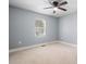 Neutral bedroom with ceiling fan, neutral carpet, base molding and a bright window at 624 Harris Nw St, Concord, NC 28025