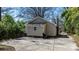 View of a cozy home surrounded by lush greenery and a private driveway at 624 Harris Nw St, Concord, NC 28025