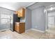 Bright kitchen with stainless steel refrigerator, granite countertops, and tile floors at 624 Harris Nw St, Concord, NC 28025