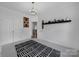 Bedroom with sleek light fixture, closet, and black and white rug at 786 Stratford Run Dr, Fort Mill, SC 29708
