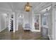 Inviting foyer featuring hardwood floors, elegant lighting, and easy access to the rest of the home at 786 Stratford Run Dr, Fort Mill, SC 29708