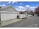 A two car garage adjacent to a white privacy fence at 786 Stratford Run Dr, Fort Mill, SC 29708