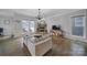 Cozy living room featuring a stone fireplace, hardwood floors, and a comfortable seating area at 786 Stratford Run Dr, Fort Mill, SC 29708