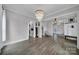 Spacious living room with hardwood floors, decorative lighting, and easy access to other living areas at 786 Stratford Run Dr, Fort Mill, SC 29708