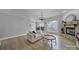 Bright open-concept living room with hardwood floors, a fireplace, and views of the backyard at 786 Stratford Run Dr, Fort Mill, SC 29708