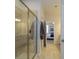 Bathroom features a glass-enclosed shower, tiled walls, and an open view to the bedroom at 8157 Merryvale Ln, Charlotte, NC 28214