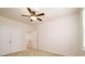 Bedroom features neutral walls, carpet flooring, a ceiling fan, and closet at 8157 Merryvale Ln, Charlotte, NC 28214
