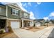 Charming townhome with stone accents, garage, and inviting front porch at 8157 Merryvale Ln, Charlotte, NC 28214