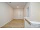 Neutral carpeted hallway features a double door closet and natural light at 8157 Merryvale Ln, Charlotte, NC 28214