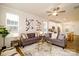 Spacious living room filled with natural light and stylish decor, showcasing the open-concept design at 8157 Merryvale Ln, Charlotte, NC 28214