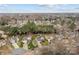 A neighborhood aerial showcasing tidy lawns, tree-lined streets, and classic suburban charm at 8932 Raven Park Dr, Charlotte, NC 28216