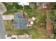 Aerial view of a home with a brick patio featuring an outdoor kitchen and dining area at 8932 Raven Park Dr, Charlotte, NC 28216