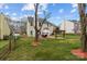 Large backyard features a patio area with a pergola and an outdoor grill, perfect for entertaining guests at 8932 Raven Park Dr, Charlotte, NC 28216