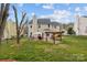 Spacious backyard with patio, pergola, and grill, ideal for gatherings and enjoying the outdoors at 8932 Raven Park Dr, Charlotte, NC 28216