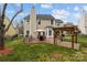 Well maintained backyard with an outdoor kitchen, patio and pergola for relaxing and dining al fresco at 8932 Raven Park Dr, Charlotte, NC 28216