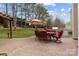 Outdoor patio with dining set, umbrella, and grill, perfect for entertaining and relaxation at 8932 Raven Park Dr, Charlotte, NC 28216