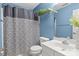 Cozy bathroom with patterned shower curtain, white vanity, and a large mirror at 8932 Raven Park Dr, Charlotte, NC 28216