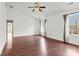 Spacious primary bedroom features wood flooring and two windows allowing lots of natural light at 8932 Raven Park Dr, Charlotte, NC 28216