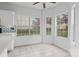 Cozy breakfast nook featuring tile floors, bright windows, and a view of the outdoors at 8932 Raven Park Dr, Charlotte, NC 28216