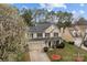 Beautiful two-story home with attached garage, manicured lawn, and flowering trees, a suburban delight at 8932 Raven Park Dr, Charlotte, NC 28216