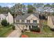 Inviting two-story home with a tidy front lawn and cozy front porch, showcasing its classic suburban charm at 8932 Raven Park Dr, Charlotte, NC 28216