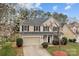 Charming two-story home featuring a two-car garage and landscaped yard at 8932 Raven Park Dr, Charlotte, NC 28216
